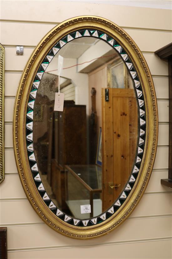 An oval Irish gilt framed wall mirror W.59cm
